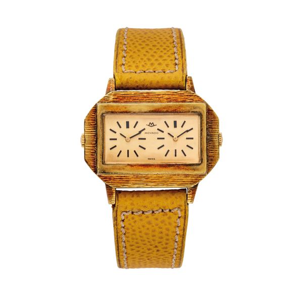 MOVADO - MOVADO - DUAL TIME OROLOGIO A CARICA MANUALE CON DOPPIO FUSO ORARIO, CASSA PLACCATA CON LAVORAZIONE A CORTECCIA.