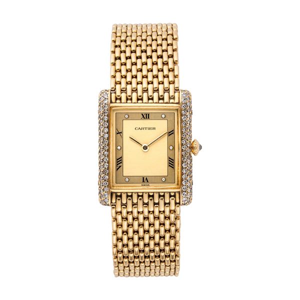 CARTIER - CARTIER - TANK OROLOGIO A CARICA MANUALE IN ORO GIALLO 18KT CON BRILLANTI E BRACCIALE IN ORO.