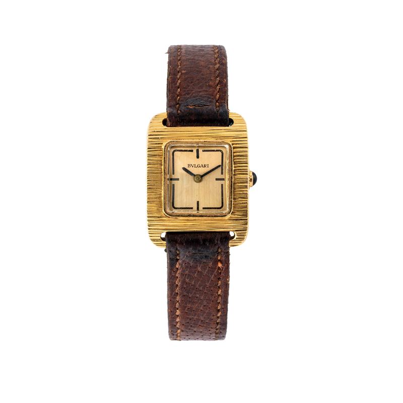 Bvlgari - Bulgari, Tank “corteccia” in oro giallo 18 kt con zaffiro cabochon