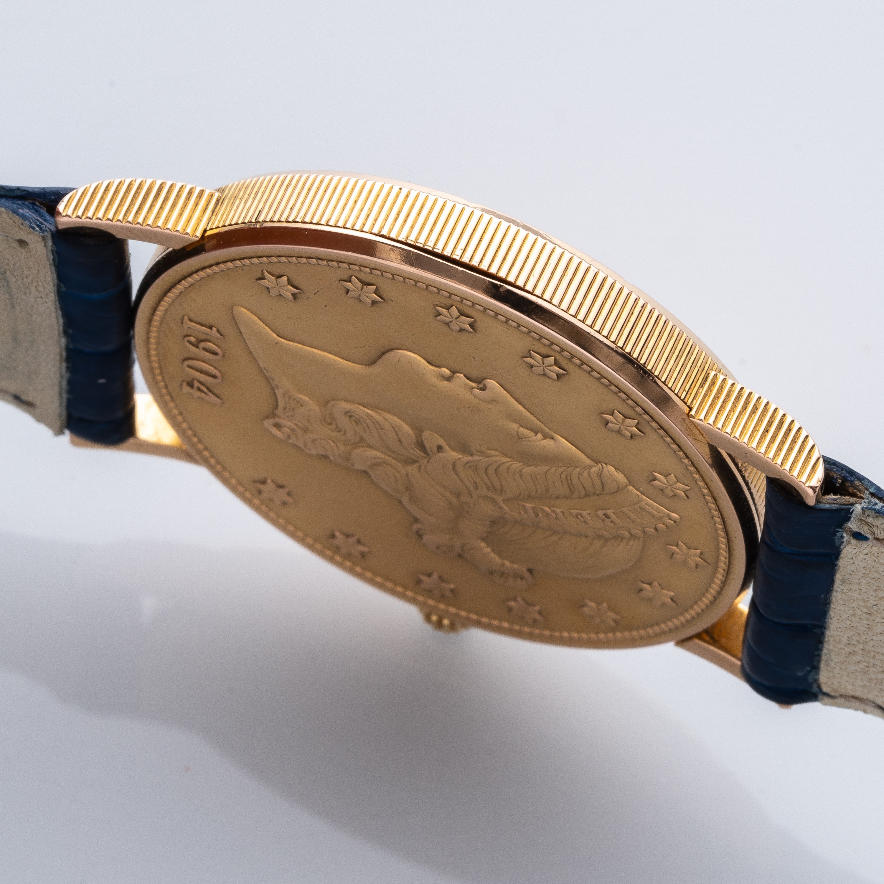 Corum - Orologio “20 Dollari” in oro giallo 18 kt, quadrante con moneta (Ref. 8869)