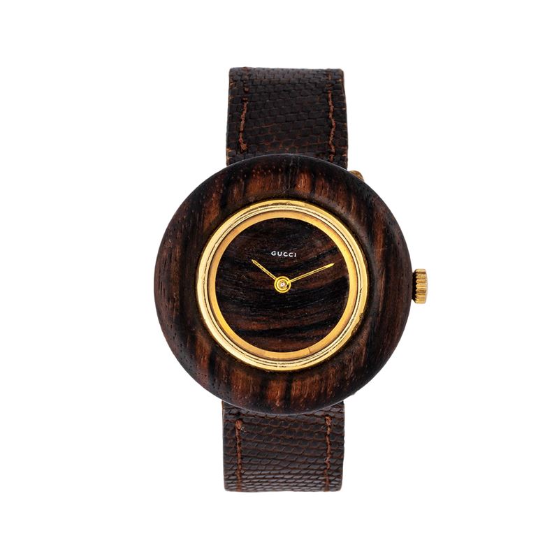 Gucci - Disco volante, orologio solo tempo in oro giallo 18 kt e radica