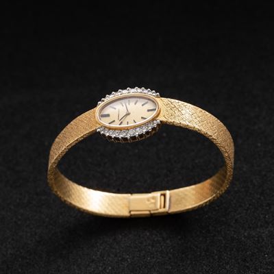 Orologio Cocktail in oro giallo 18 kt con carica manuale e ghiera diamantata