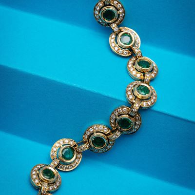 Bracciale in oro giallo 18 kt con smeraldi e brillantini