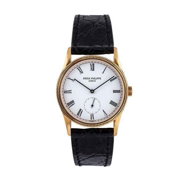 PATEK PHILIPPE - PATEK PHILIPPE - CALATRAVA OROLOGIO SOLO TEMPO A CARICA MANUALE IN ORO GIALLO 18KT CON PICCOLI SECONDI AD ORE SEI, QUADRANTE BIANCO E GHIERA 'CLOU DE PARIS'