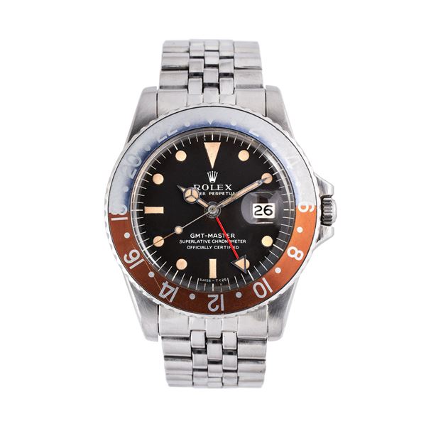 ROLEX - ROLEX - GMT MASTER OROLOGIO GMT A CARICA AUTOMATICA CON QUADRANTE TROPICALE 'LONG E' MARRONE,GHIERA VIRATA BIDIREZIONALE E DATARIO AD ORE TRE.