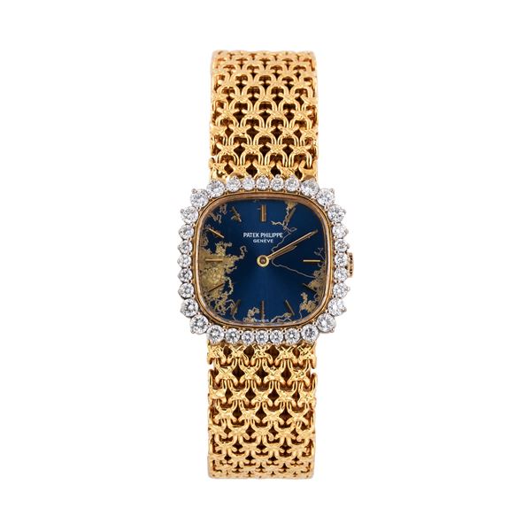 PATEK PHILIPPE - PATEK PHILIPPE OROLOGIO SOLO TEMPO A CARICA MANUALE IN ORO GIALLO 18KT CON QUADRANTE BLU VIRATO GHIERA DIAMANTI TAGLIO BRILLANTE  E BRACCIALE INTEGRATO IN ORO GIALLO 18KT LAVORATO