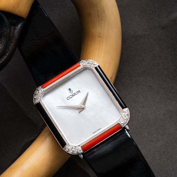 CORUM - CORUM - TANK OROLOGIO SOLO TEMPO A CARICA MANUALE IN ORO BIANCO 18KT CON QUADRANTE MADREPERLA, GHIERA CON ONICE, CORALLO E DIAMANTE TAGLIO BRILLANTE