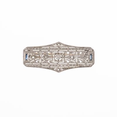 Spilla in oro bianco 18 kt con diamante centrale e sei rosette di diamanti