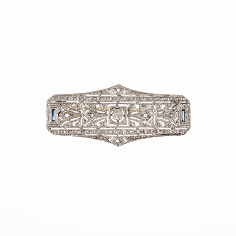 Spilla in oro bianco 18 kt con diamante centrale e sei rosette di diamanti