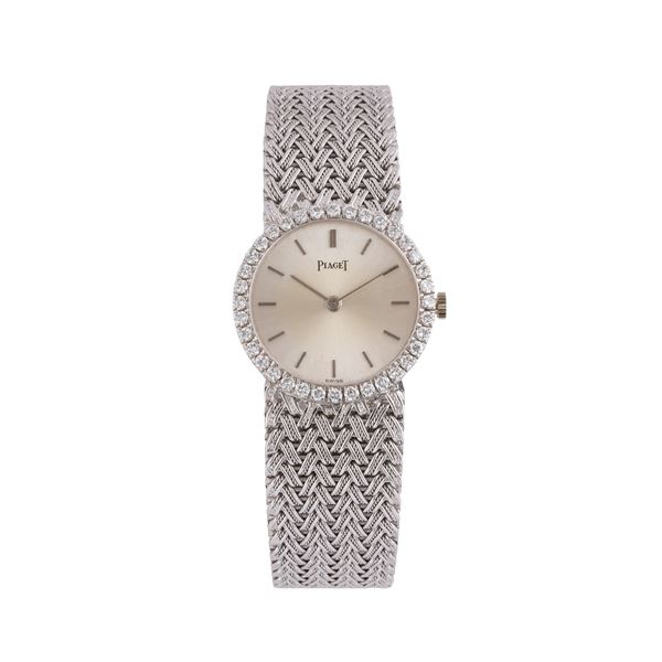 PIAGET OROLOGIO SOLO TEMPO A CARICA MANUALE IN ORO BIANCO 18KT CON BRACCIALE INTEGRATO IN ORO BIANCO 18KT, QUADRANTE ARGENTE' E GHIERA IN DIAMANTI TAGLIO BRILLANTE