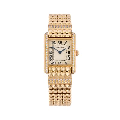 Tank, orologio solo tempo al quarzo in oro giallo 18 kt con ghiera in diamanti e bracciale in oro...