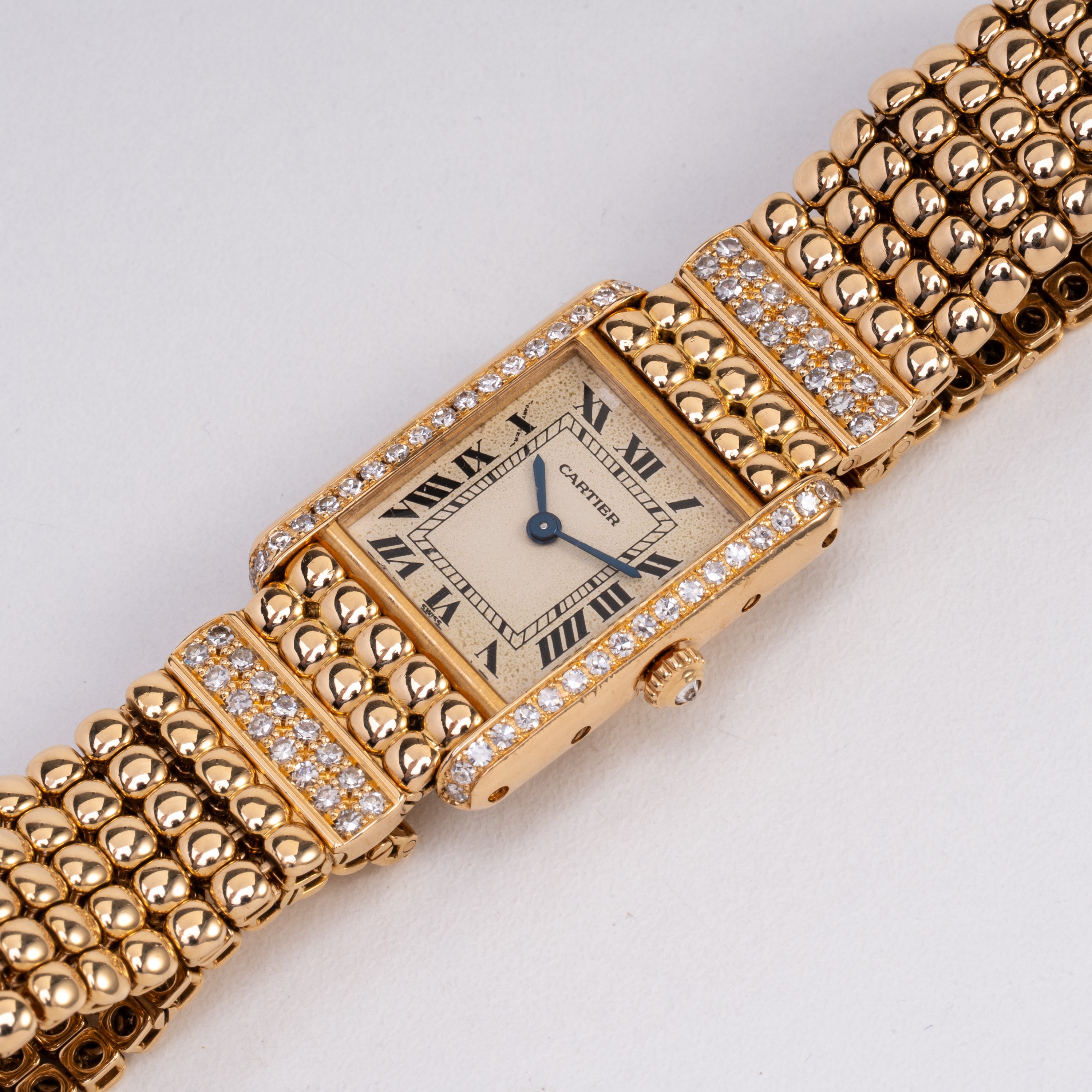 Cartier - Tank, orologio solo tempo al quarzo in oro giallo 18 kt con ghiera in diamanti e bracci...