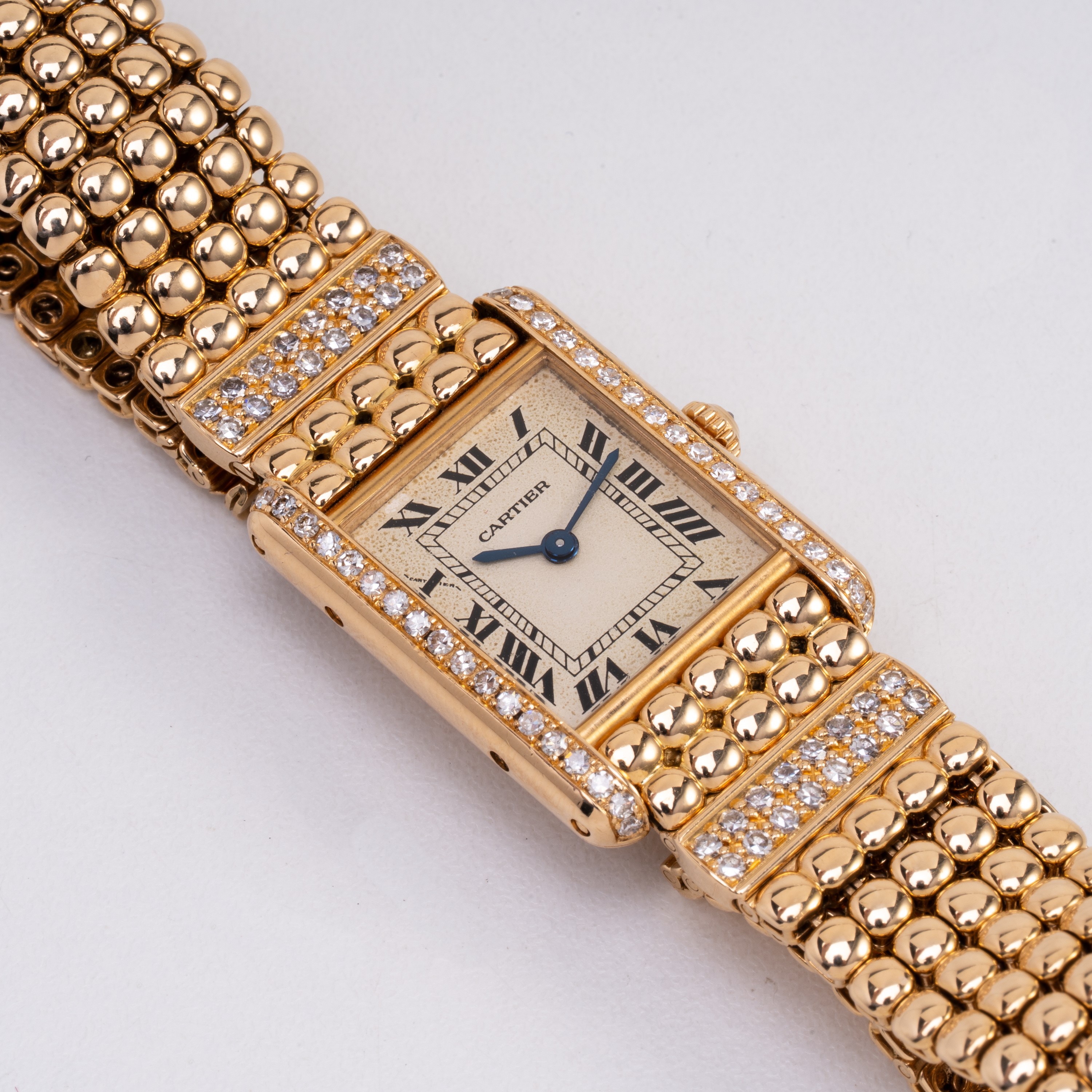 Cartier - Tank, orologio solo tempo al quarzo in oro giallo 18 kt con ghiera in diamanti e bracci...