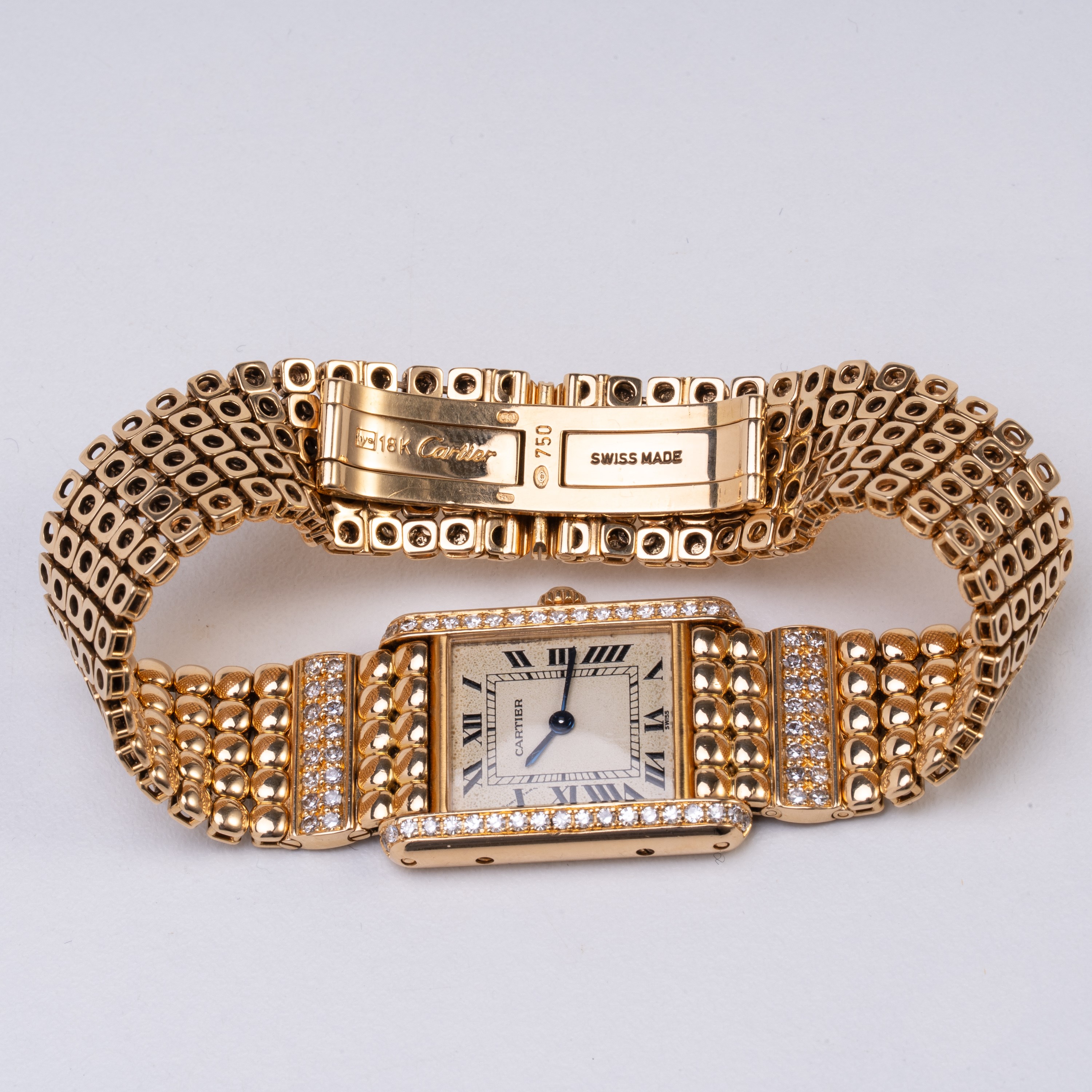 Cartier - Tank, orologio solo tempo al quarzo in oro giallo 18 kt con ghiera in diamanti e bracci...
