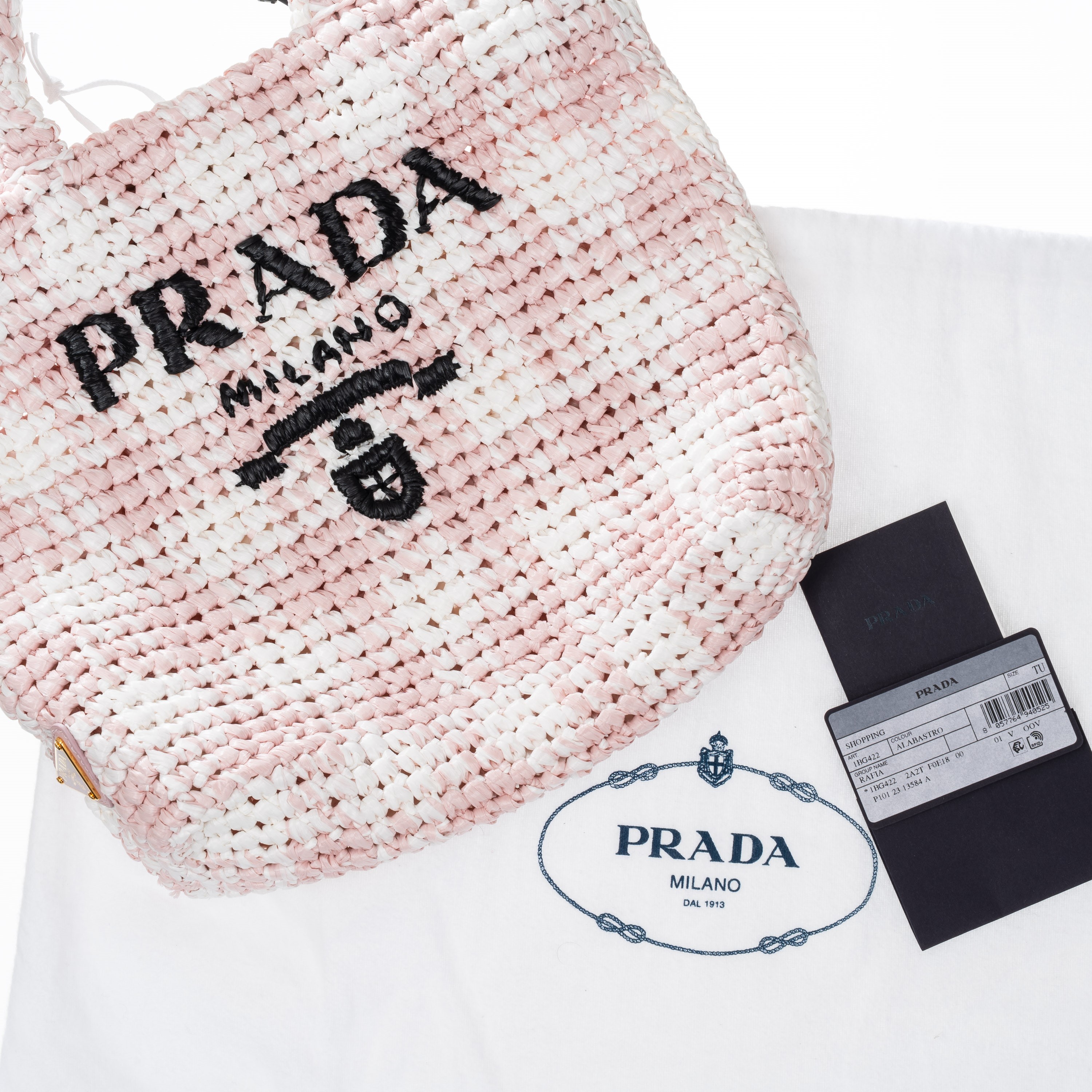 Prada - Shopper a mano in tessuto effetto rafia bianco e rosa