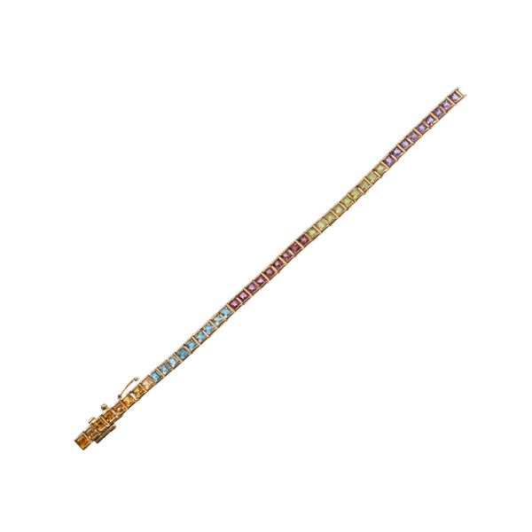 BRACCIALE IN ORO GIALLO CON AMETISTA, PERIDOTO GRANATO, TOPAZIO AZZURRO E QUARZO CITRINO TAGLIO CARRÉ 