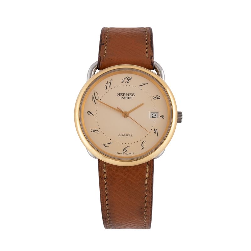Hermès - Orologio Solo Tempo al quarzo in acciaio con quadrante champagne, ghiera dorata e datari...