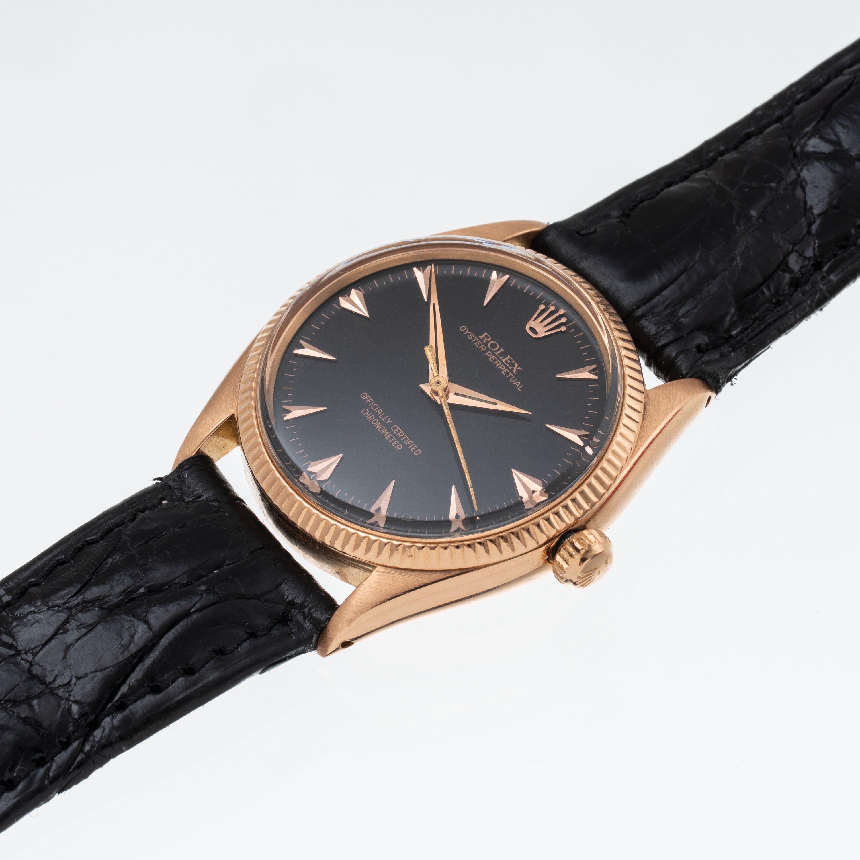 Rolex - Oyster Perpetual 6567 (1955) — orologio solo tempo in oro rosa 18 kt con quadrante nero