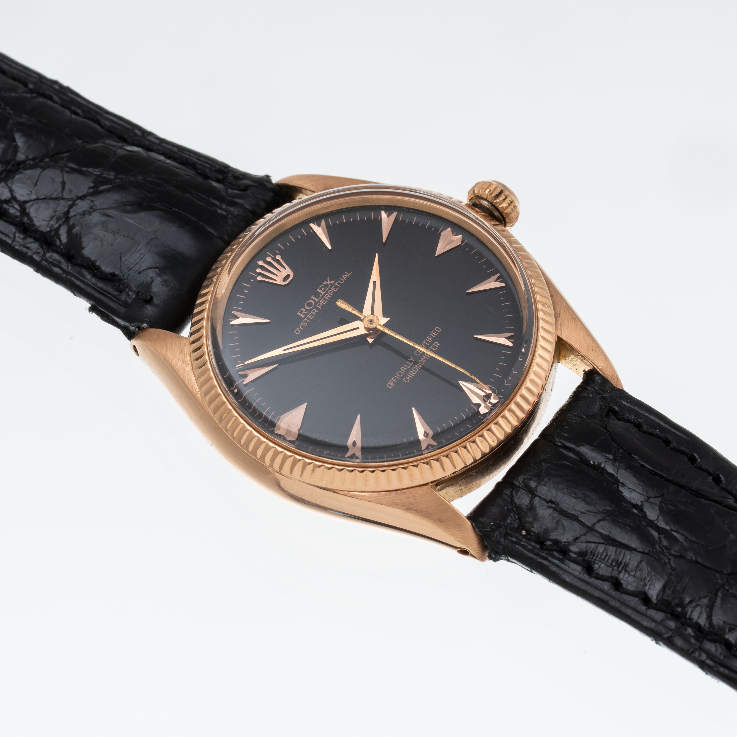 Rolex - Oyster Perpetual 6567 (1955) — orologio solo tempo in oro rosa 18 kt con quadrante nero