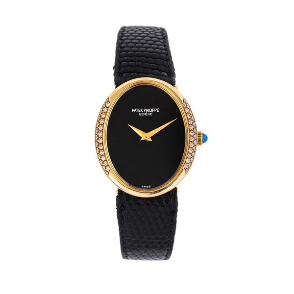 PATEK PHILIPPE - PATEK PHILIPPE - ELLIPSE LADY OROLOGIO SOLO TEMPO A CARICA MANUALE IN ORO GIALLO 18 KT CON QUADRANTE IN ONICE E GHIERA IN DIAMANTI TAGLIO BRILLANTE