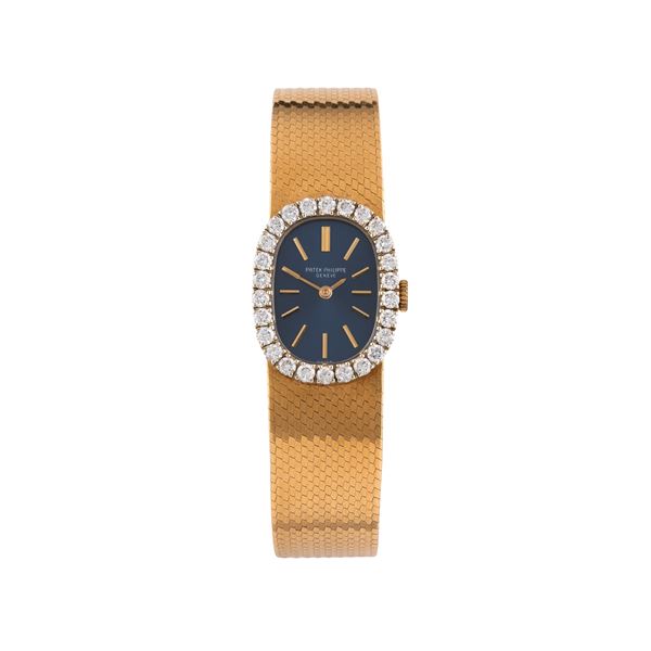 PATEK PHILIPPE - PATEK PHILIPPE - ELLIPPSE OROLOGIO SOLO TEMPO A CARICA MANUALE IN ORO GIALLO 18 KT CON BRACCIALE INTEGRATO IN ORO GIALLO 18 KT, GHIERA IN DIAMANTE TAGLIO BRILLANTE E QUADRANTE BLU