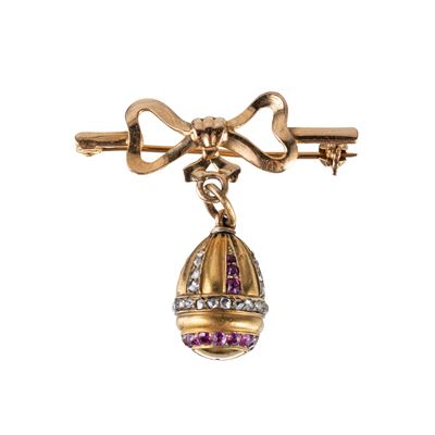Spilla a fiocco in oro rosa 18kt con ovetto pendente, rubini e diamanti taglio antico