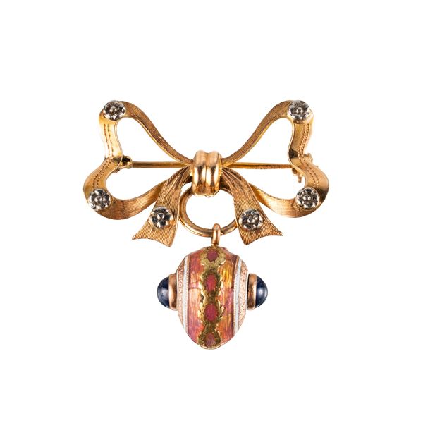 SPILLA A FIOCCO IN ORO ROSA 18KT CON OVETTO E ZAFFIRI CABOCHON