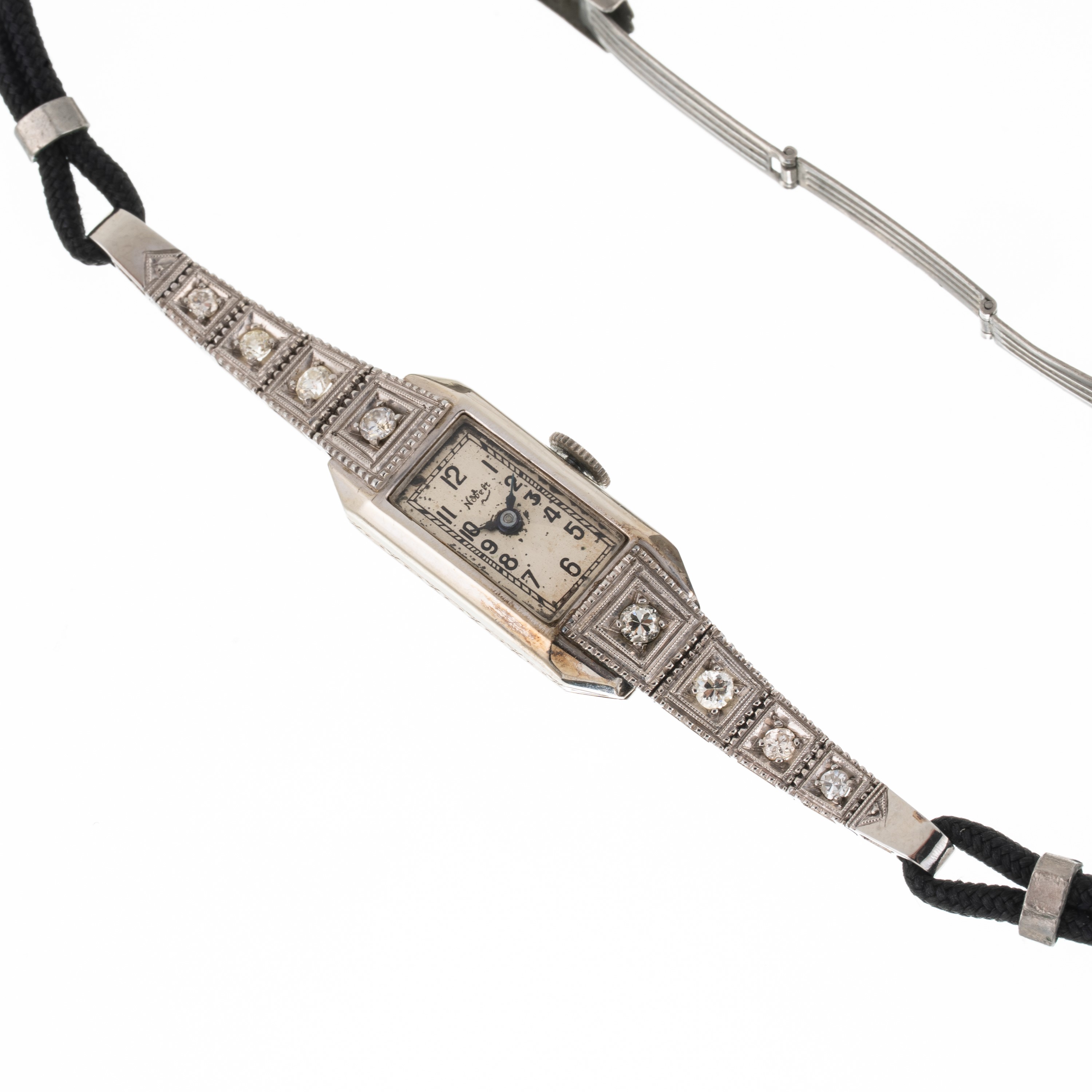 Nobelt, Orologio “Art Decò” solo tempo a carica manuale in oro bianco 18 kt con brillanti
