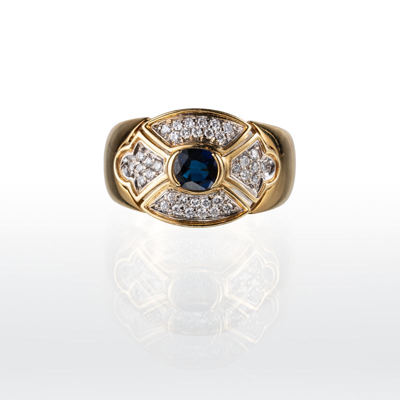 Anello in oro giallo 18 kt con zaffiro blu e diamanti, misura 15/55