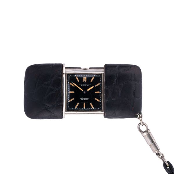 MOVADO - MOVADO - HERMETO OROLOGIO DA VIAGGIO A CARICA MANUALE IN ARGENTO CON QUADRANTE NERO CON TIMBRO DEL RIVENDITORE HAUSMANN
