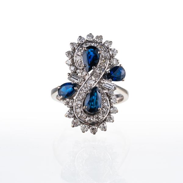 ANELLO IN ORO BIANCO 18 KT CON ZAFFIRI A GOCCIA E DIAMANTI